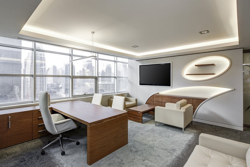 Office desk with laptop and office supplies